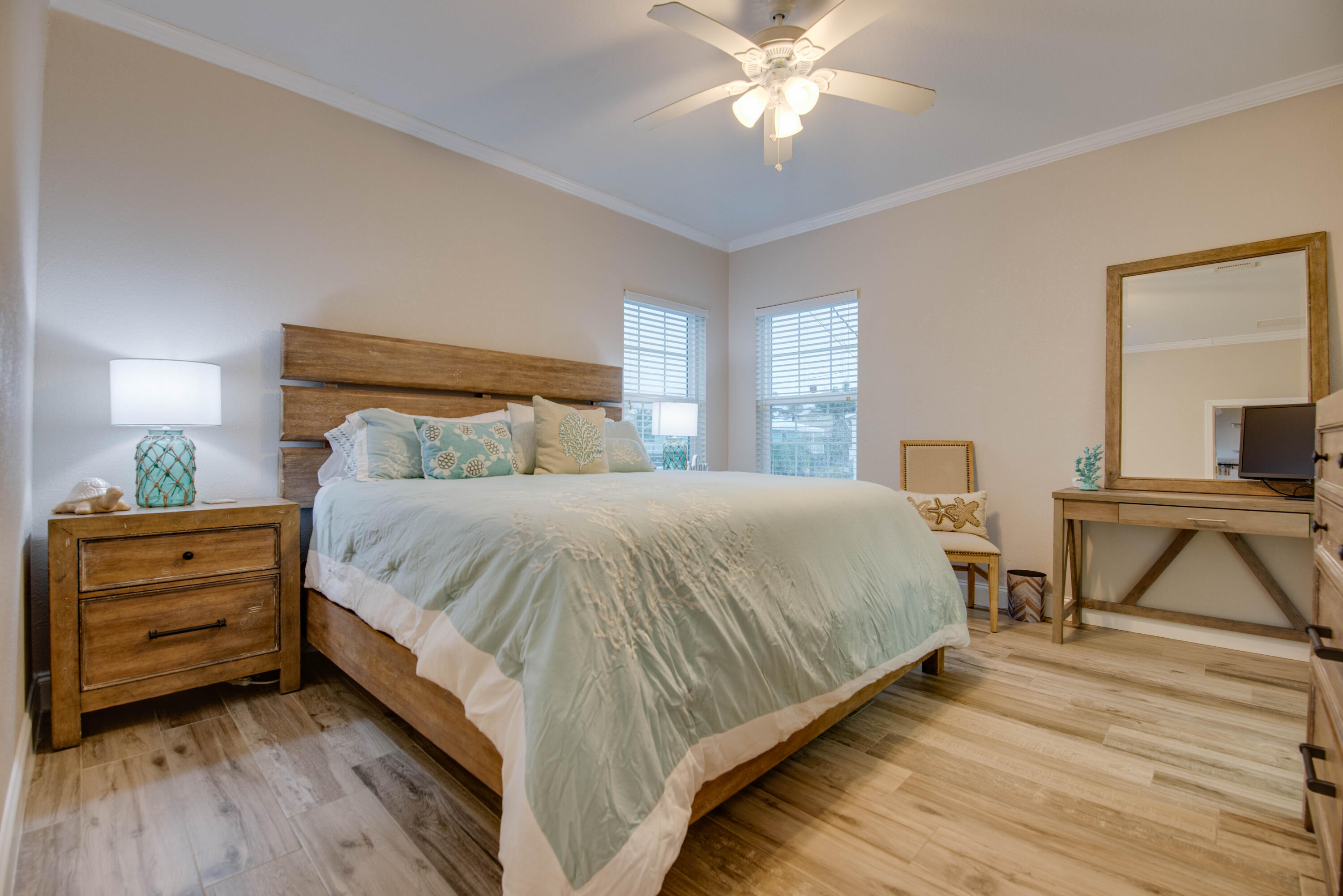 27373 Antigua Road Summerland Key, FL 33042 - Photo 11 of 31 a bedroom with a bed and a chandelier