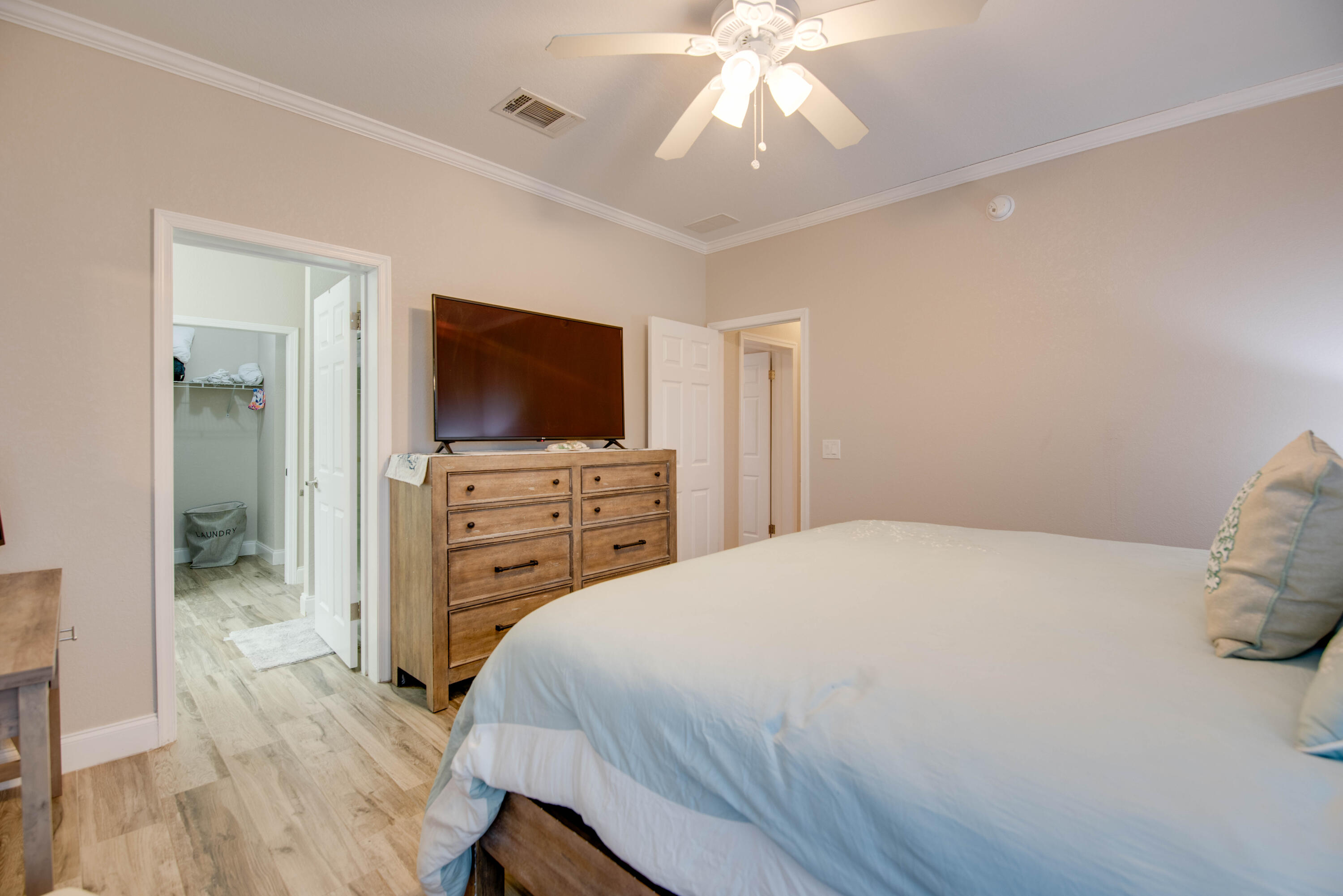 27373 Antigua Road Summerland Key, FL 33042 - Photo 12 of 31 a bedroom with a bed and wooden floor