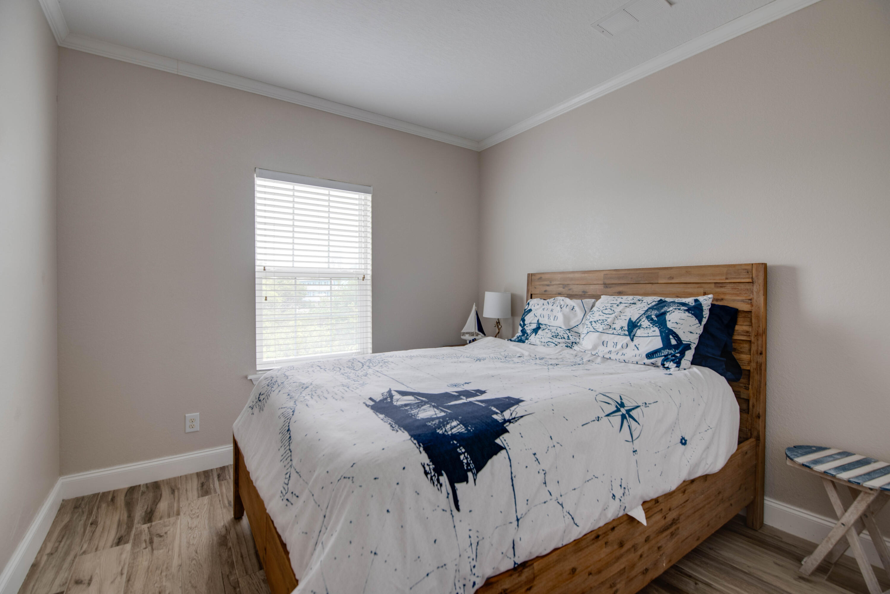 27373 Antigua Road Summerland Key, FL 33042 - Photo 15 of 31 a large bed sitting in a bedroom next to a window