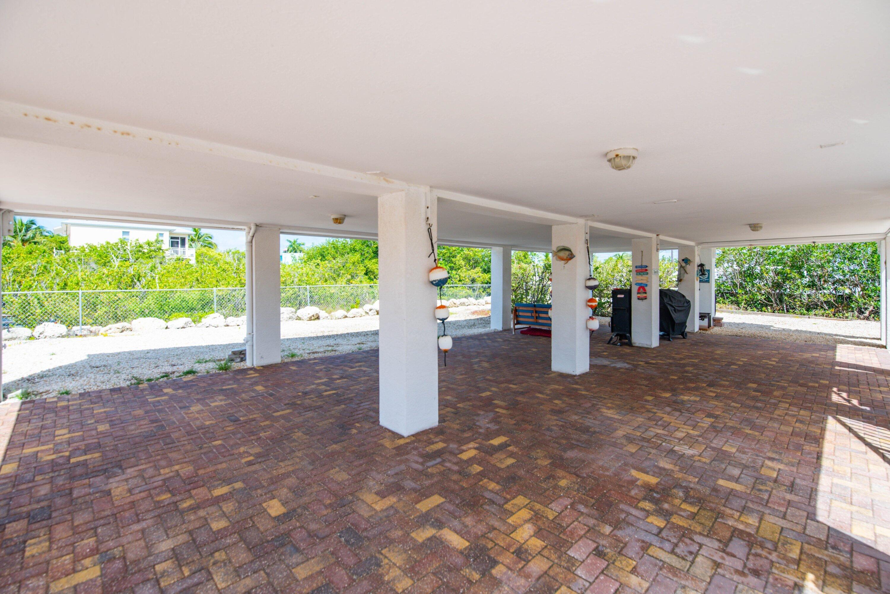 27373 Antigua Road Summerland Key, FL 33042 - Photo 23 of 31 a view of a garden with plants and large trees