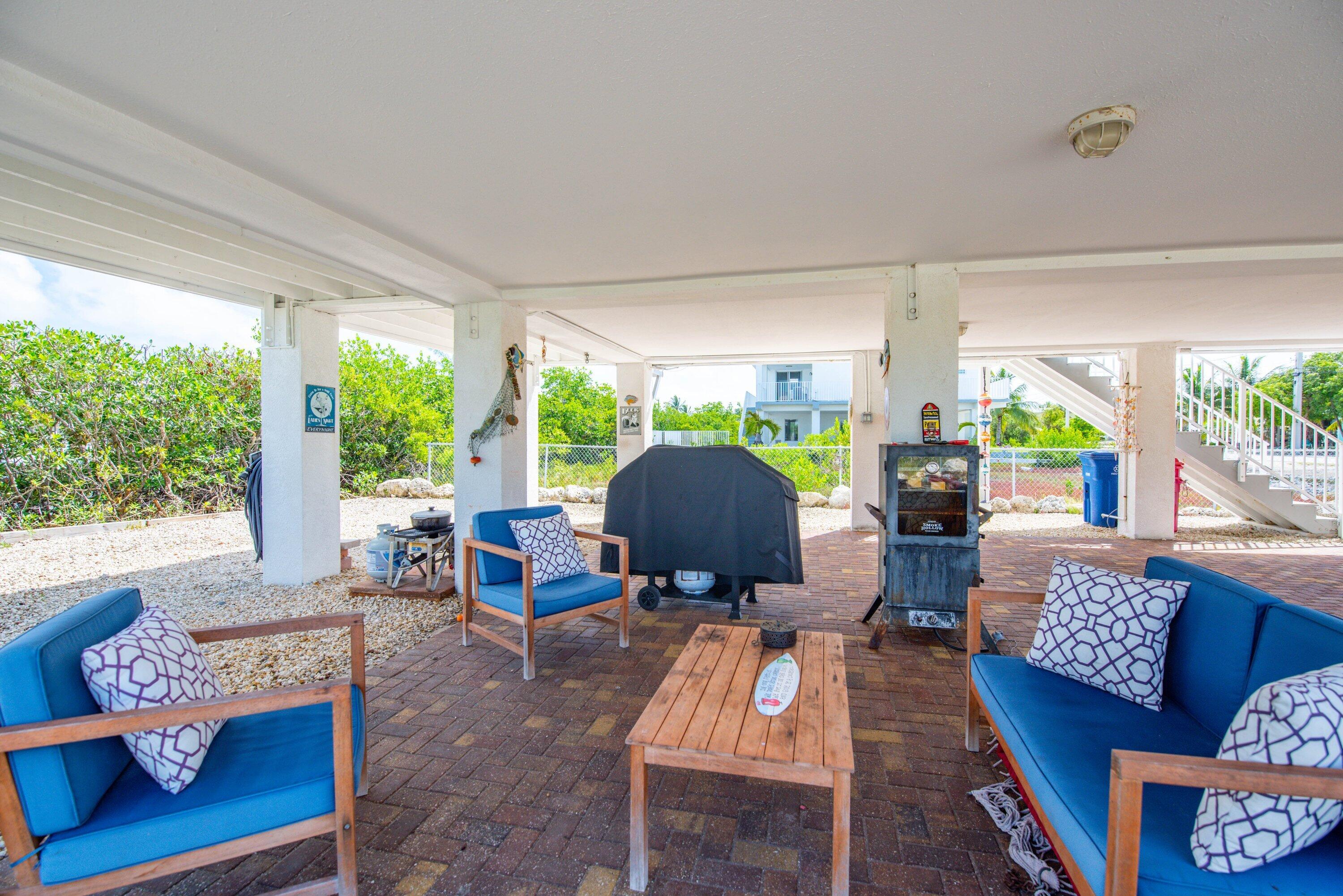 27373 Antigua Road Summerland Key, FL 33042 - Photo 24 of 31 a living room with furniture and a large window