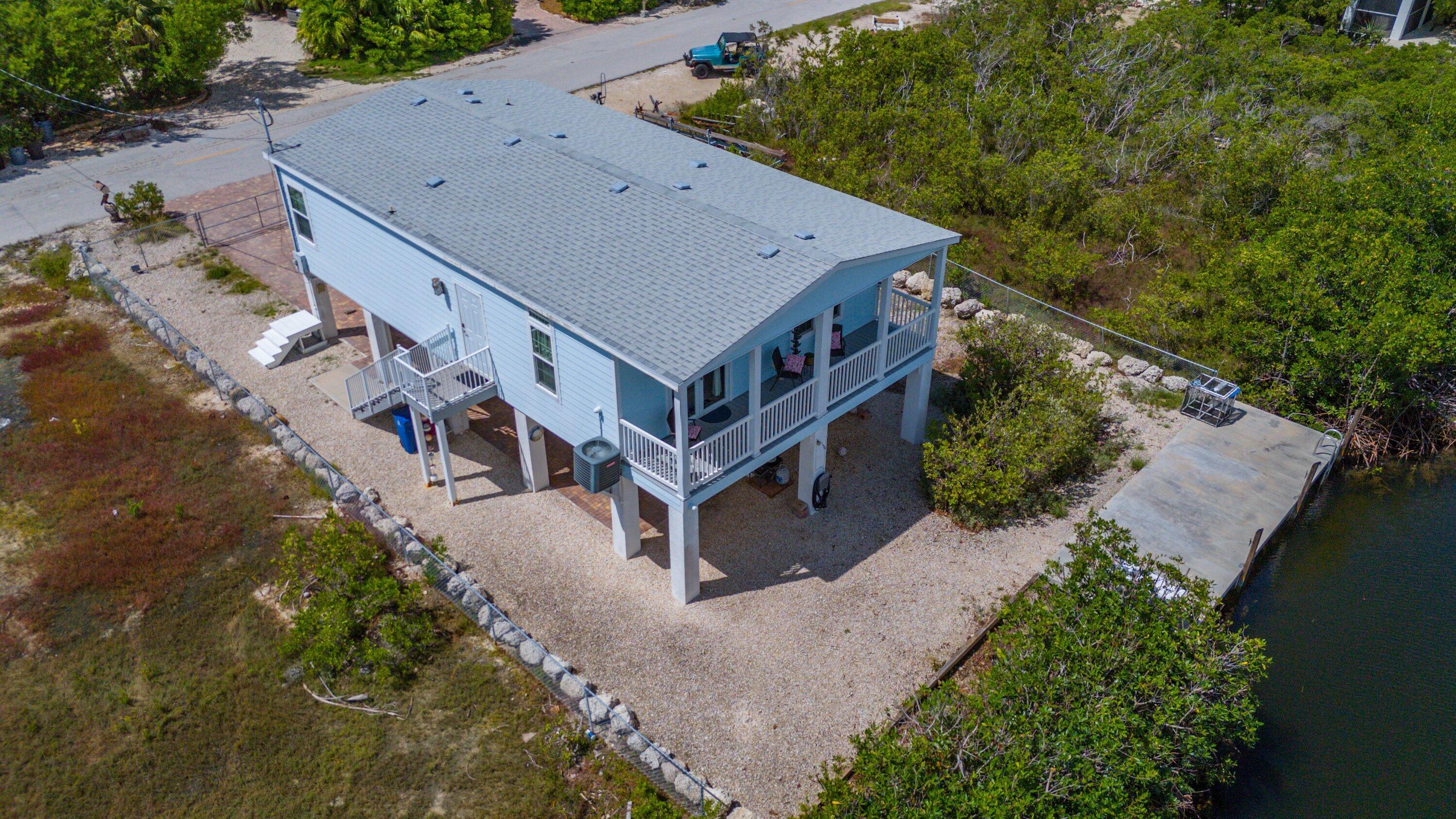 27373 Antigua Road Summerland Key, FL 33042 - Photo 28 of 31 an aerial view of a house with a yard and large tree