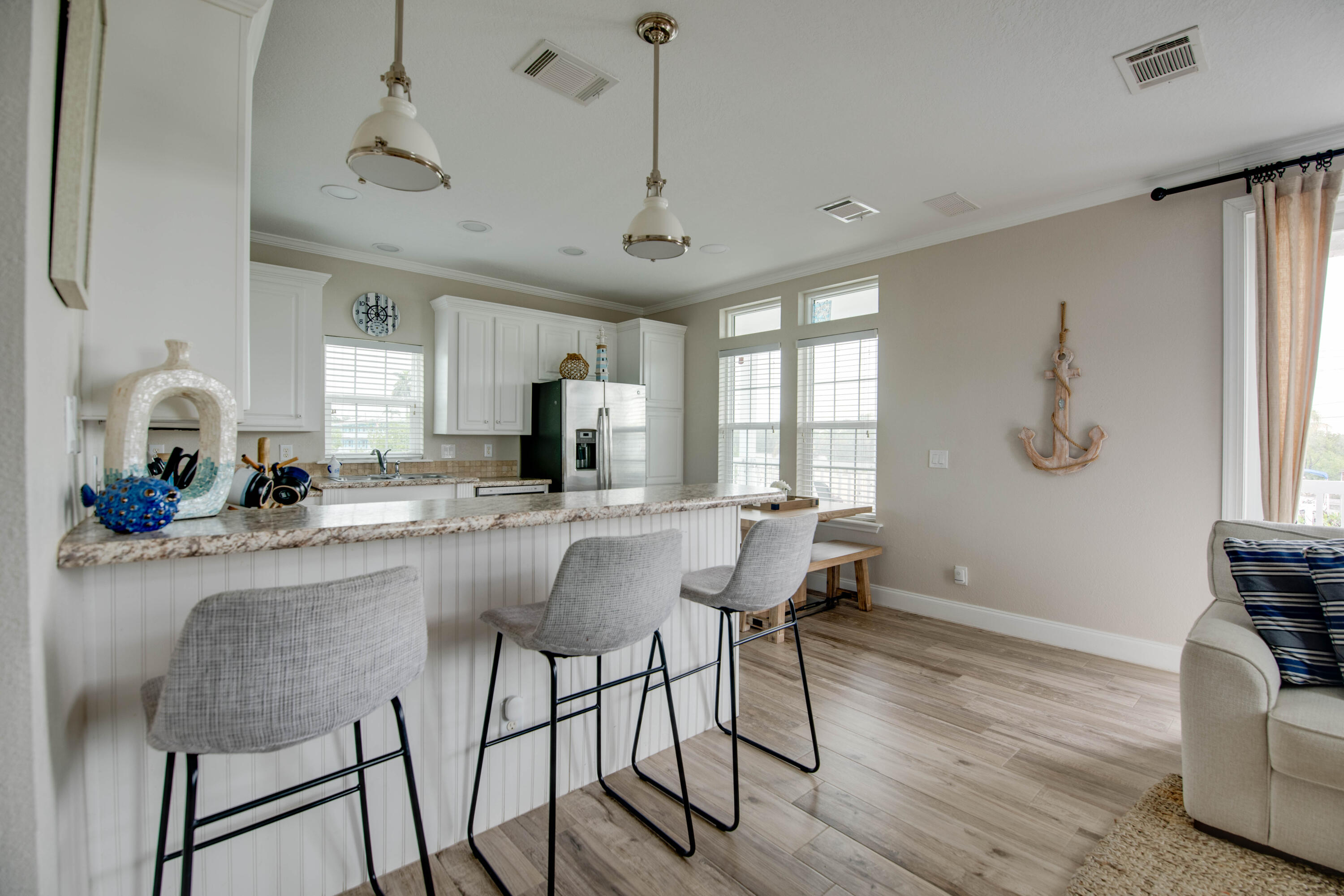 27373 Antigua Road Summerland Key, FL 33042 - Photo 5 of 31 a view of a dining room with furniture window and wooden floor