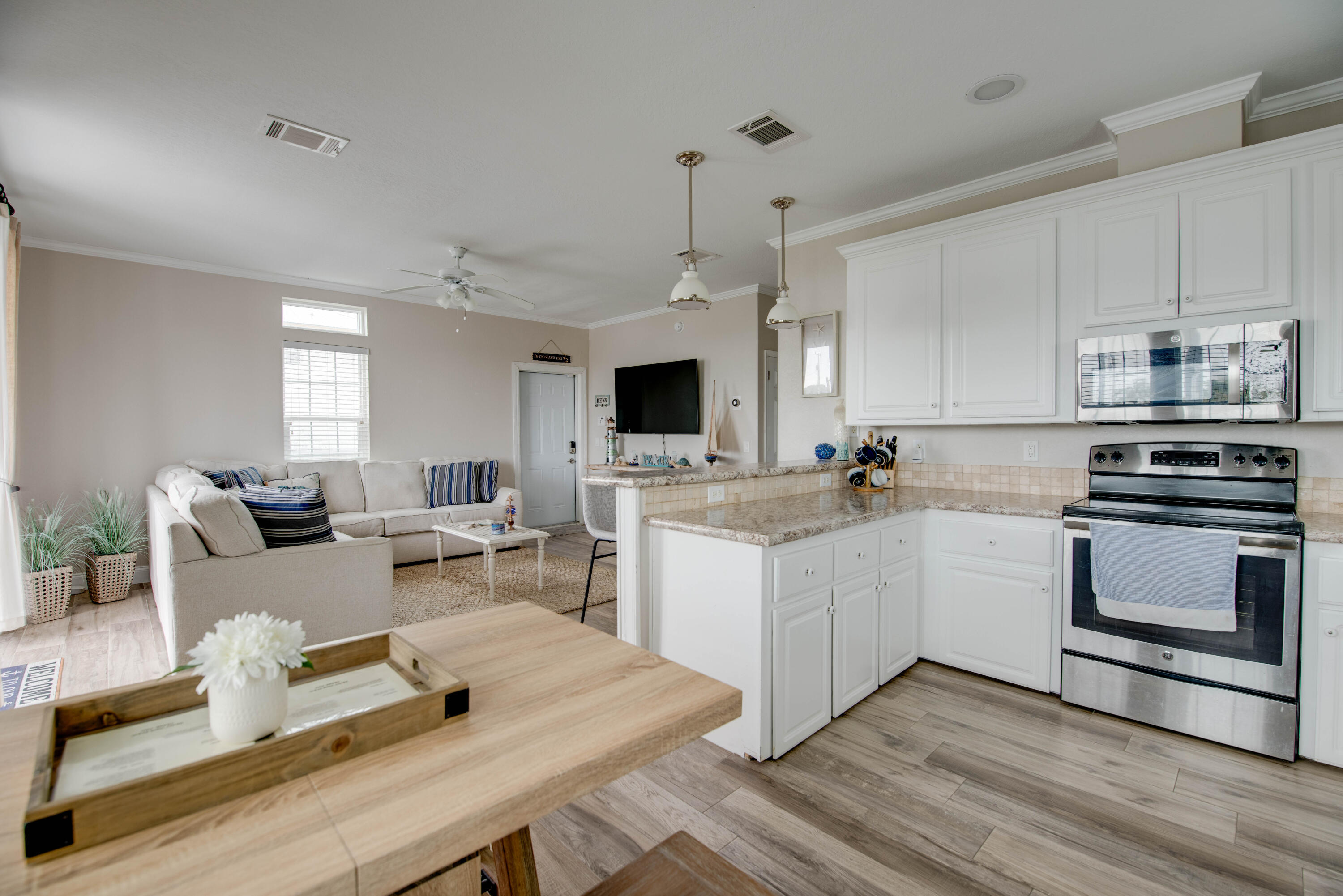 27373 Antigua Road Summerland Key, FL 33042 - Photo 9 of 31 a kitchen with a sink stove and white cabinets
