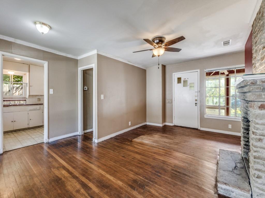 9127 San Fernando Way Dallas, TX 75218 - Photo 4 of 12 a view of an empty room with a window