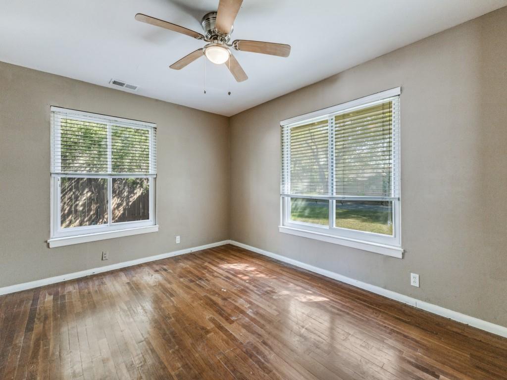 9127 San Fernando Way Dallas, TX 75218 - Photo 7 of 12 a view of an empty room with wooden floor and a window