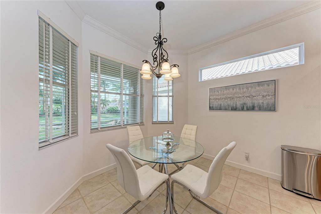 7128 Rue De Palisades, Unit 22 Sarasota, FL 34238 - Photo 16 of 41 a dining room with furniture and window