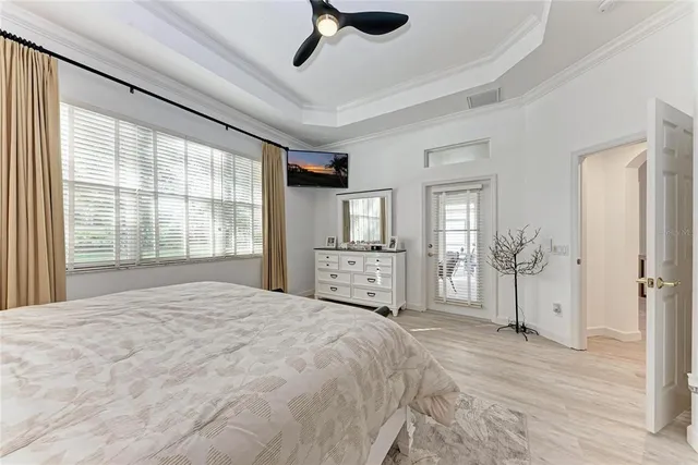 a bedroom with a large bed and a window