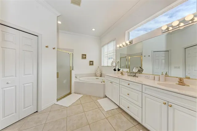 a spacious bathroom with a granite countertop sink mirror and a
