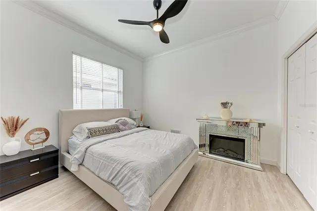 a bedroom with a bed and a fireplace