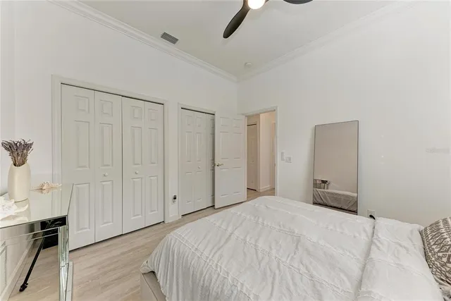 a bedroom with a bed and a cabinet