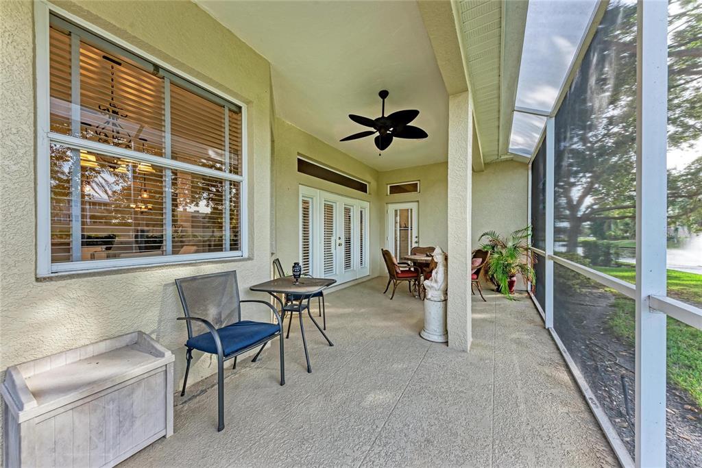 7128 Rue De Palisades, Unit 22 Sarasota, FL 34238 - Photo 33 of 41 a view of a livingroom with furniture and hardwood floor