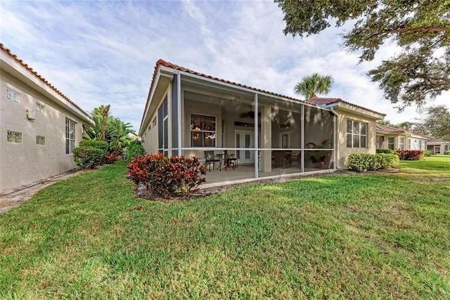 a view of a house with backyard porch and garden