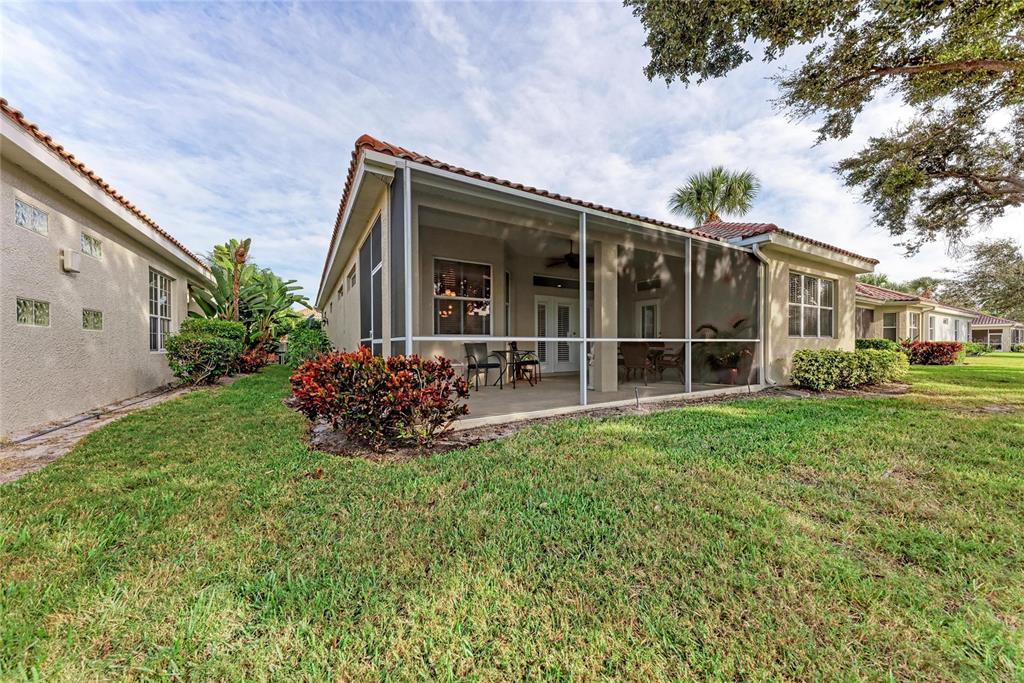 7128 Rue De Palisades, Unit 22 Sarasota, FL 34238 - Photo 34 of 41 a view of a house with backyard porch and garden