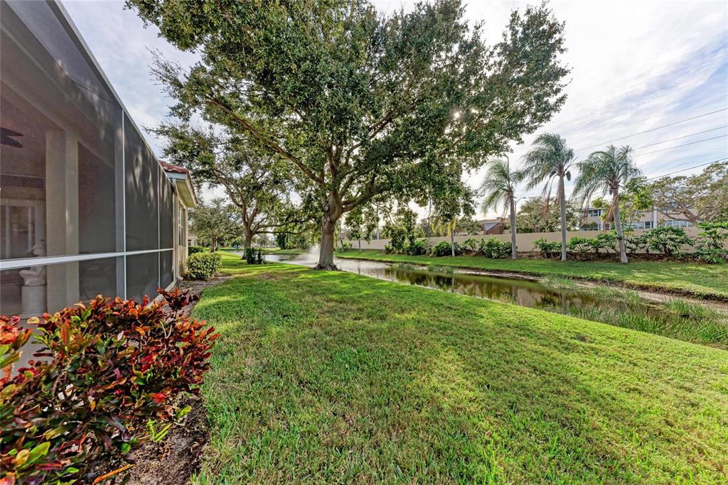 7128 Rue De Palisades, Unit 22 Sarasota, FL 34238 - Photo 35 of 41 a view of a park with large trees
