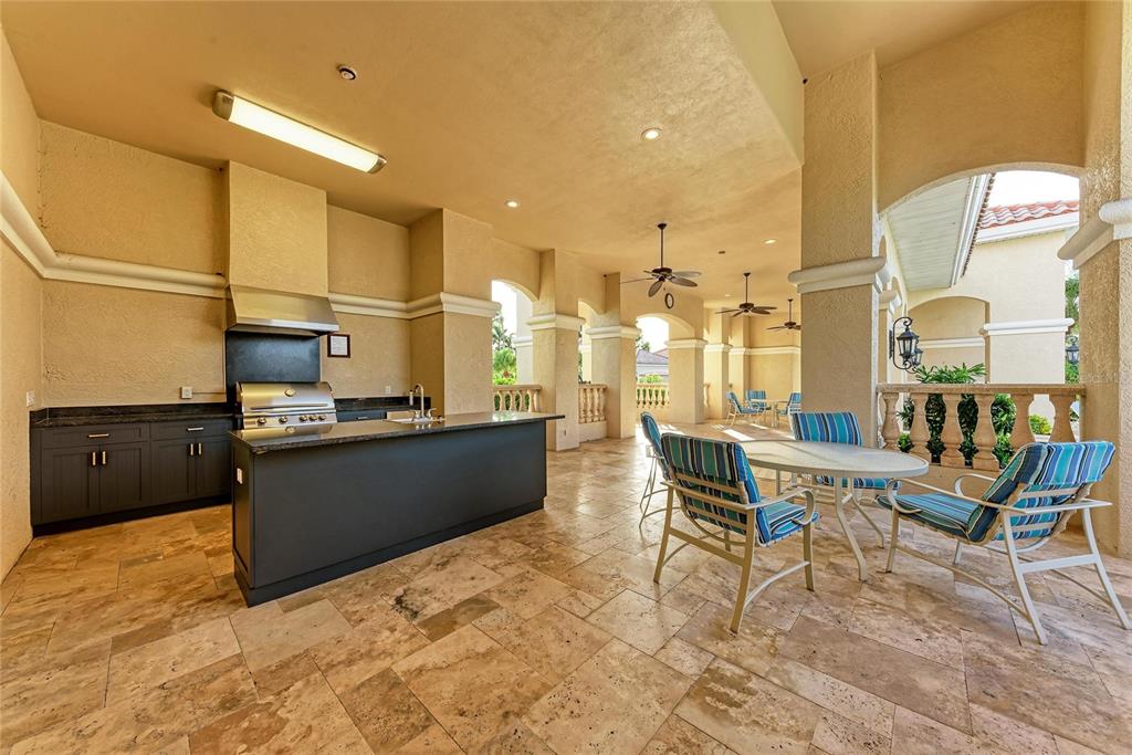 7128 Rue De Palisades, Unit 22 Sarasota, FL 34238 - Photo 40 of 41 a view of a living room and kitchen