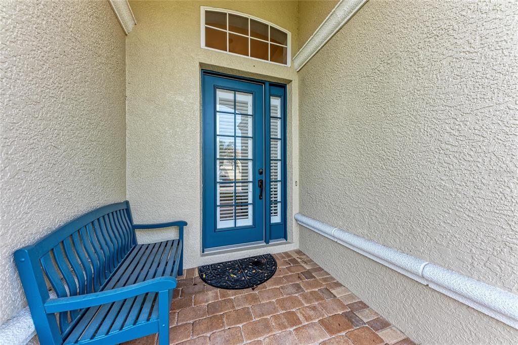 7128 Rue De Palisades, Unit 22 Sarasota, FL 34238 - Photo 4 of 41 a view of front door with chair
