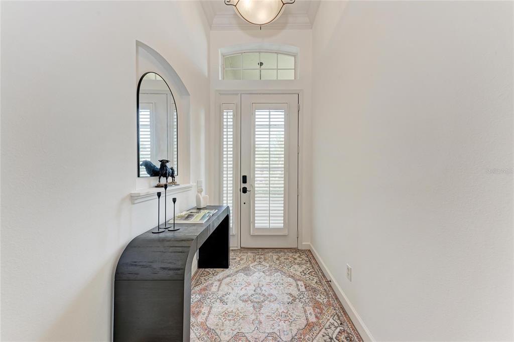 7128 Rue De Palisades, Unit 22 Sarasota, FL 34238 - Photo 5 of 41 a front view of a house with wooden floor