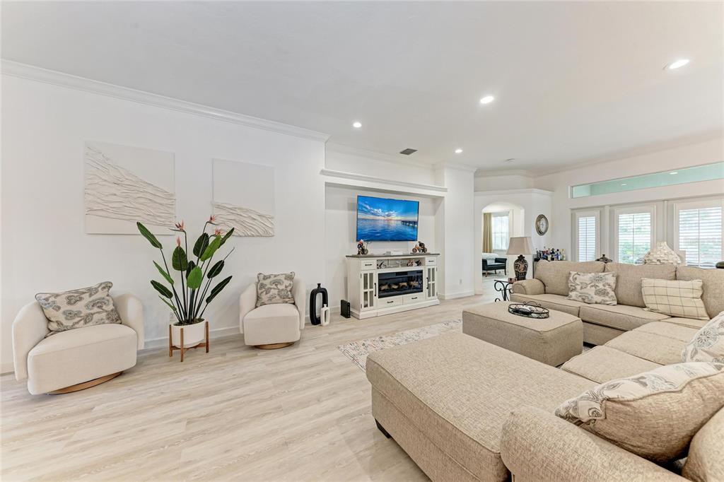7128 Rue De Palisades, Unit 22 Sarasota, FL 34238 - Photo 7 of 41 a living room with furniture a couch and a flat screen tv