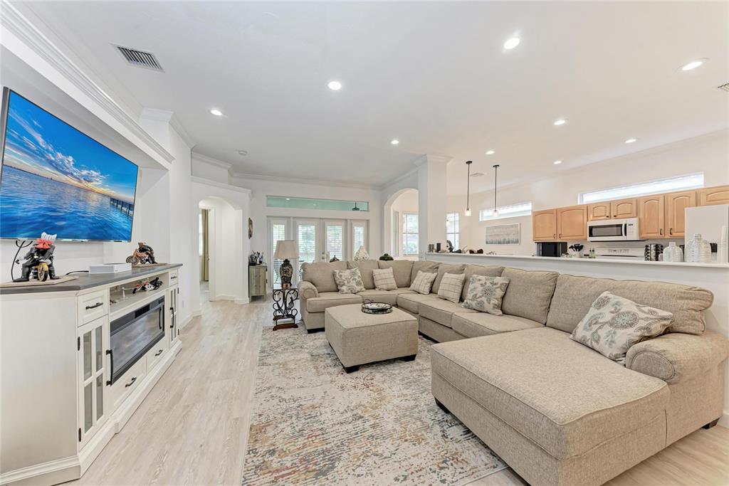 7128 Rue De Palisades, Unit 22 Sarasota, FL 34238 - Photo 8 of 41 a living room with furniture and kitchen view