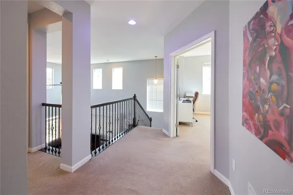 a spacious bedroom with a bed and a window