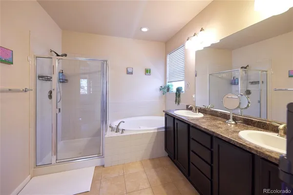 a bathroom with a granite countertop sink and a vanity