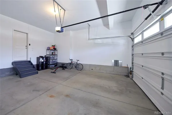 a view of a yard with wooden fence