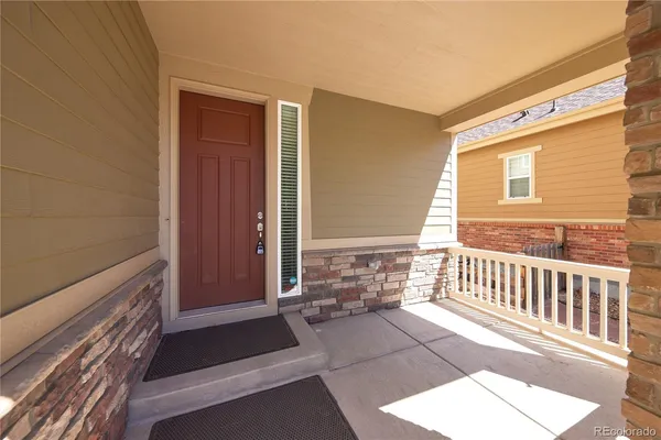 a kitchen with a sink stove top oven and cabinets