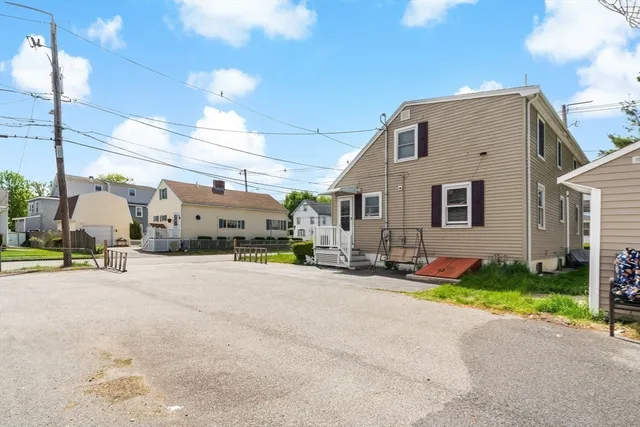 a view of a house with outdoor space and sitting area