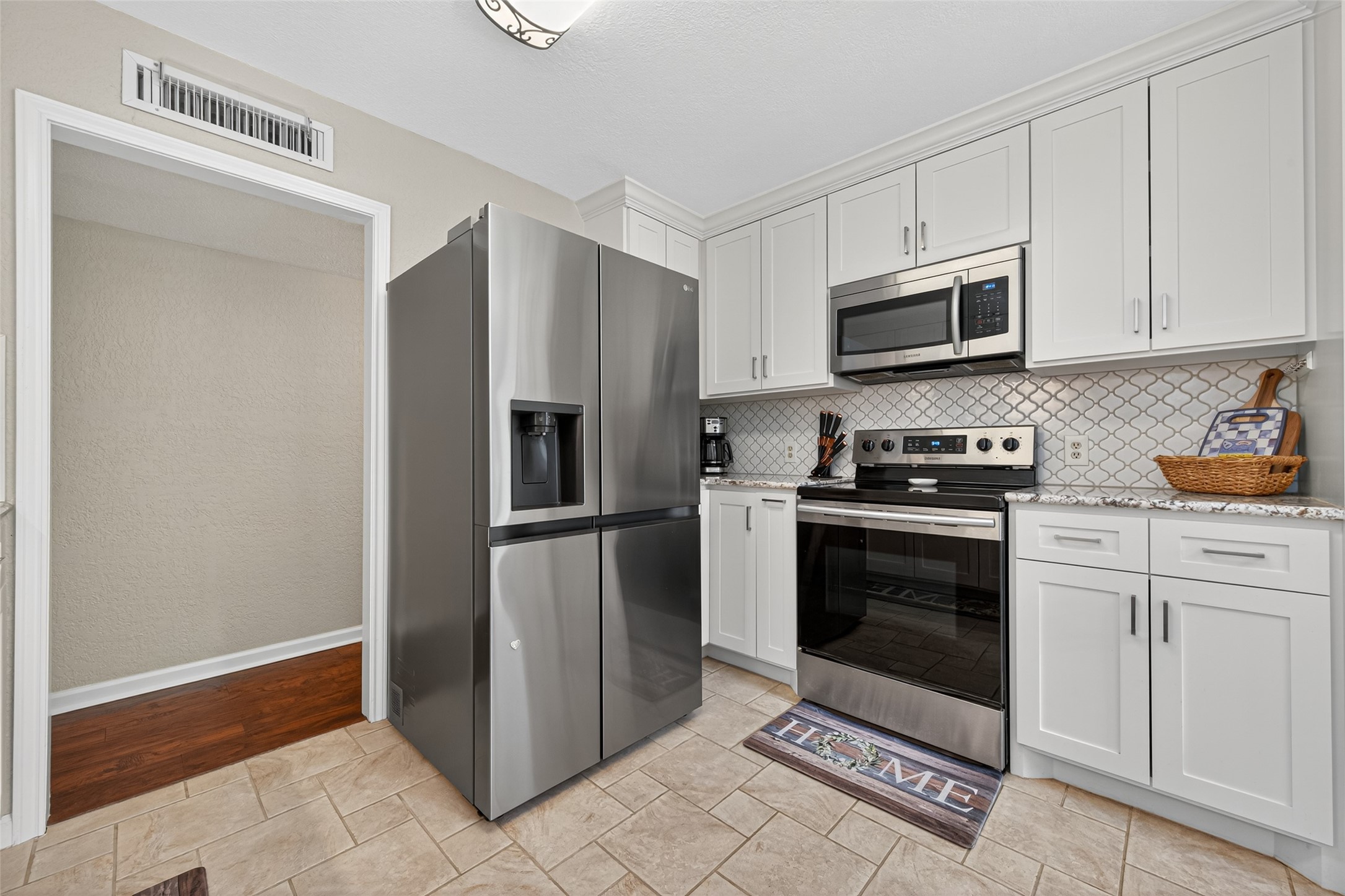 22815 Thadd's Trail Spring, TX 77373 - Photo 22 of 48 a kitchen with stainless steel appliances granite countertop a refrigerator stove and sink