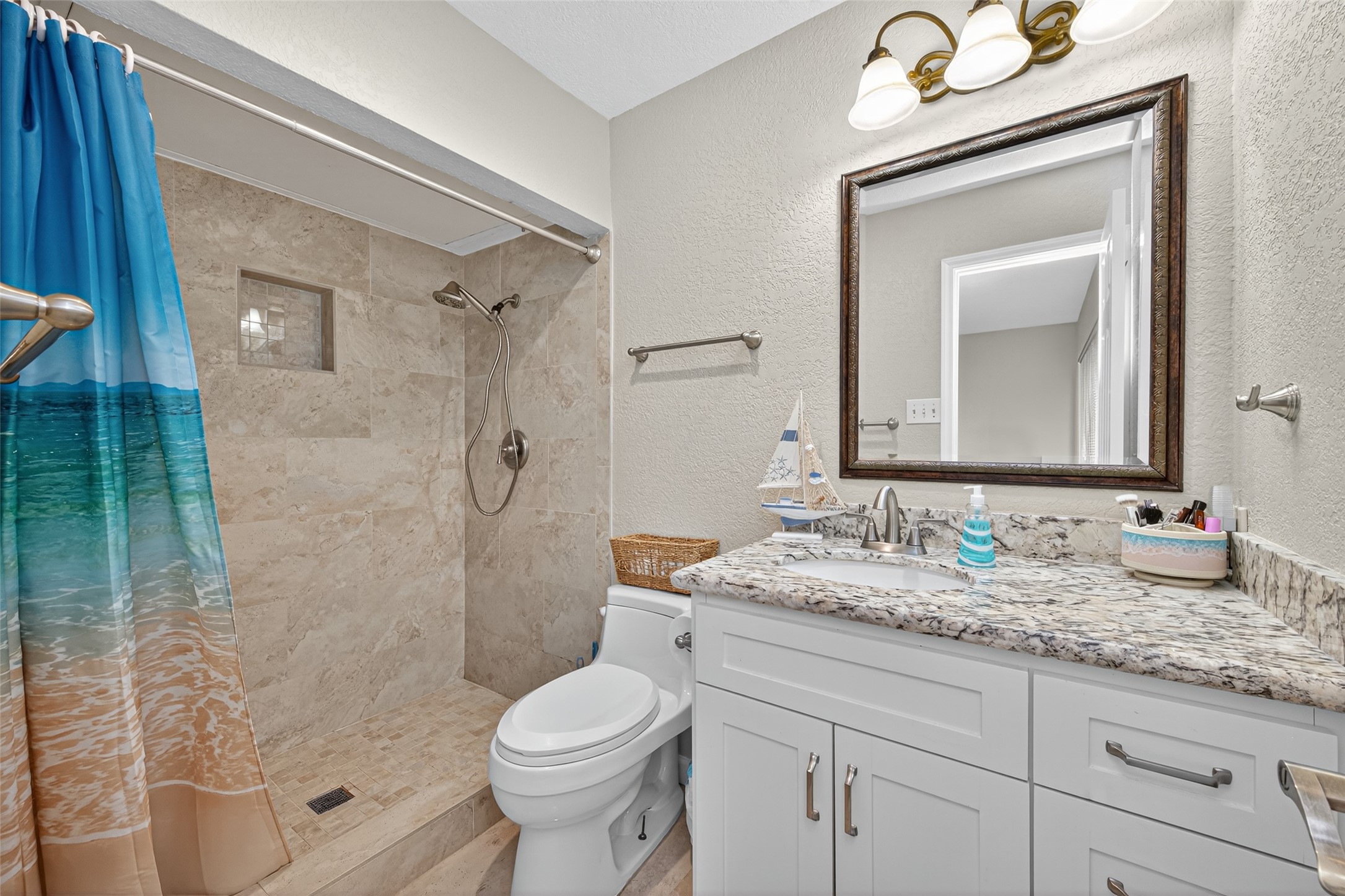 22815 Thadd's Trail Spring, TX 77373 - Photo 37 of 48 a bathroom with a granite countertop sink a toilet and shower