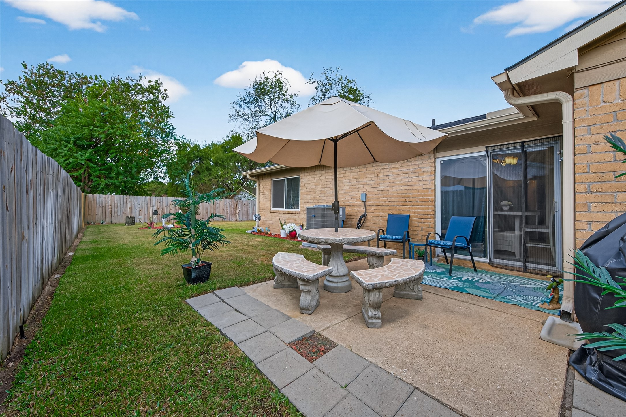 22815 Thadd's Trail Spring, TX 77373 - Photo 39 of 48 a view of a patio with table and chairs under an umbrella