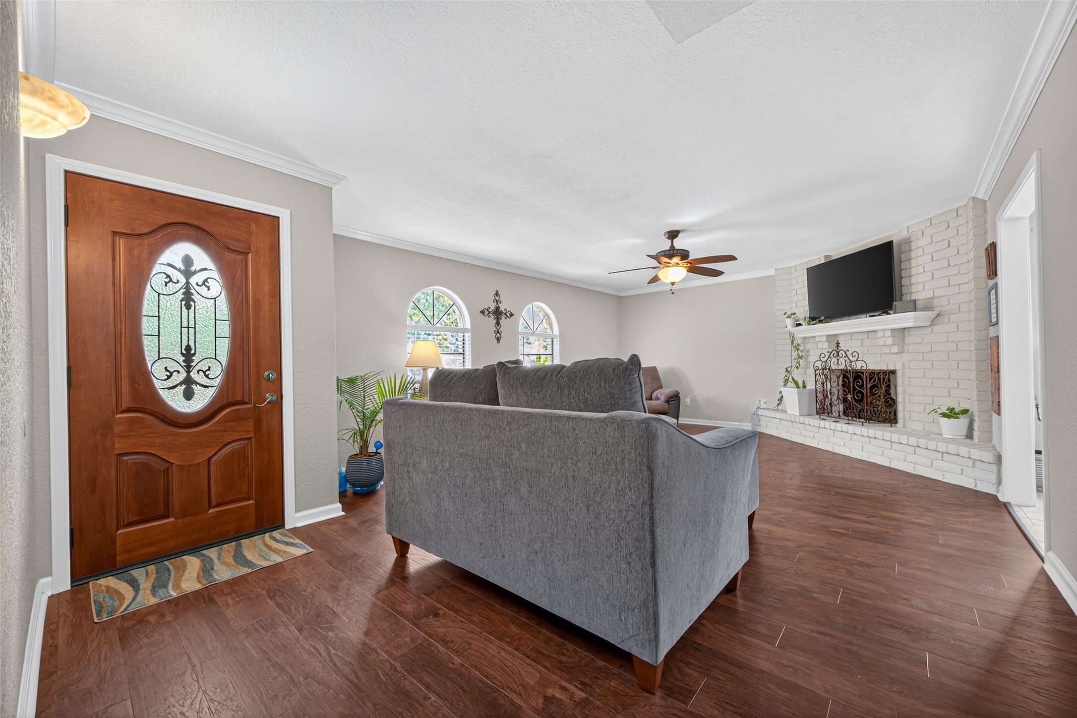 22815 Thadd's Trail Spring, TX 77373 - Photo 9 of 48 a living room with furniture a fireplace and a flat screen tv