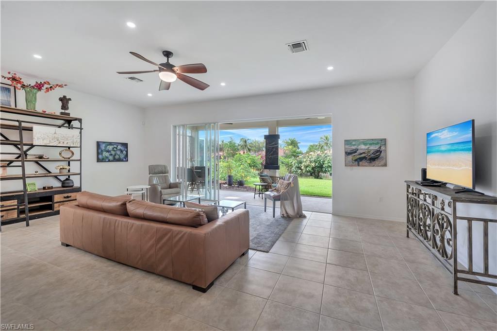 14095 Mirror Court Naples, FL 34114 - Photo 5 of 45 Living room with ceiling fan, light tile patterned flooring, and recessed lighting