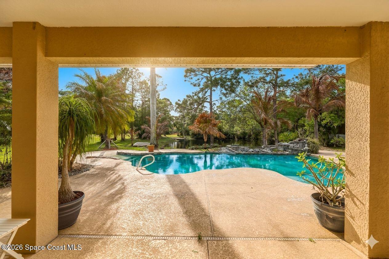 2300 Duncil Lane Malabar, FL 32950 - Photo 13 of 86 a view of swimming pool with a yard