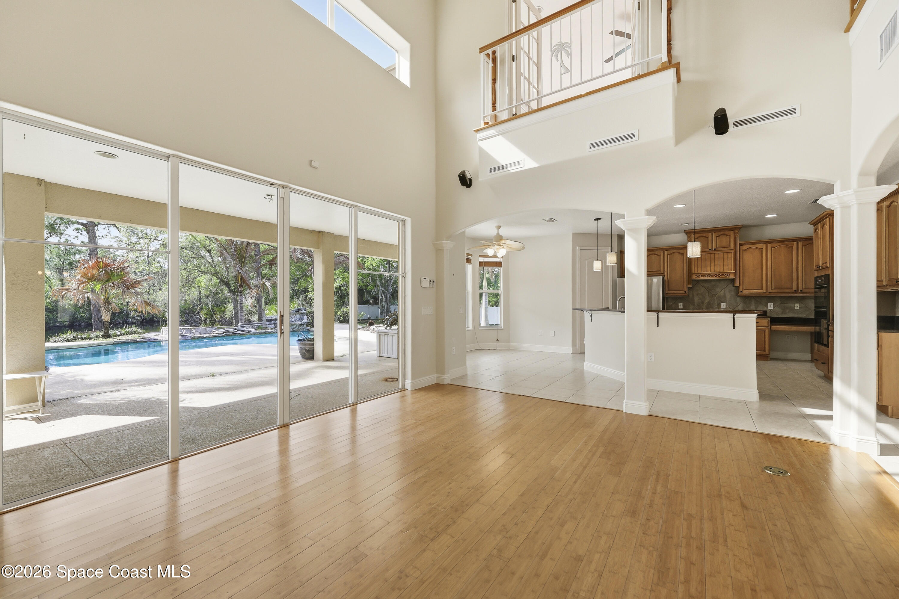 2300 Duncil Lane Malabar, FL 32950 - Photo 14 of 86 a view of an entryway with wooden floor and windows