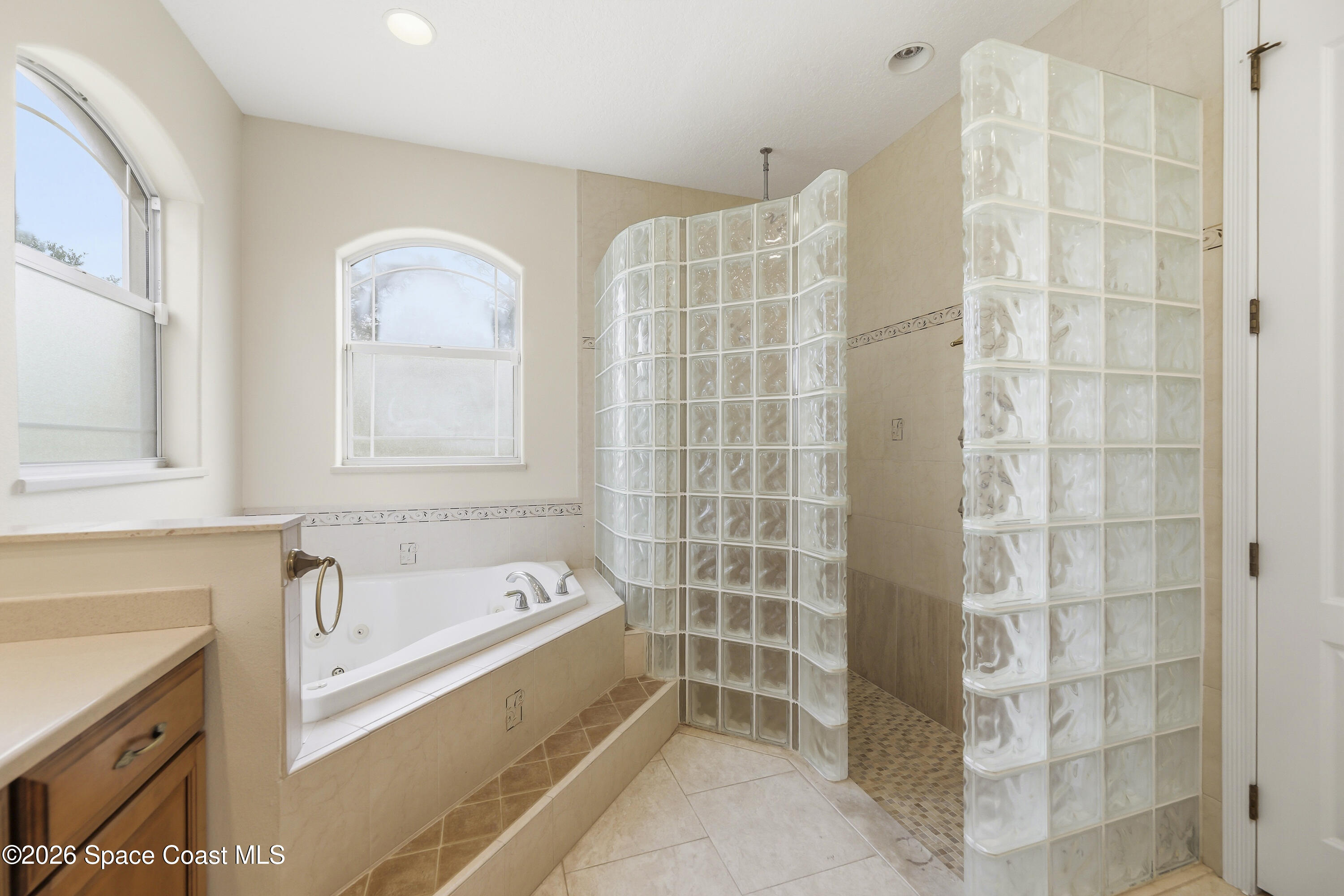 2300 Duncil Lane Malabar, FL 32950 - Photo 35 of 86 a bathroom with a bathtub and a shower