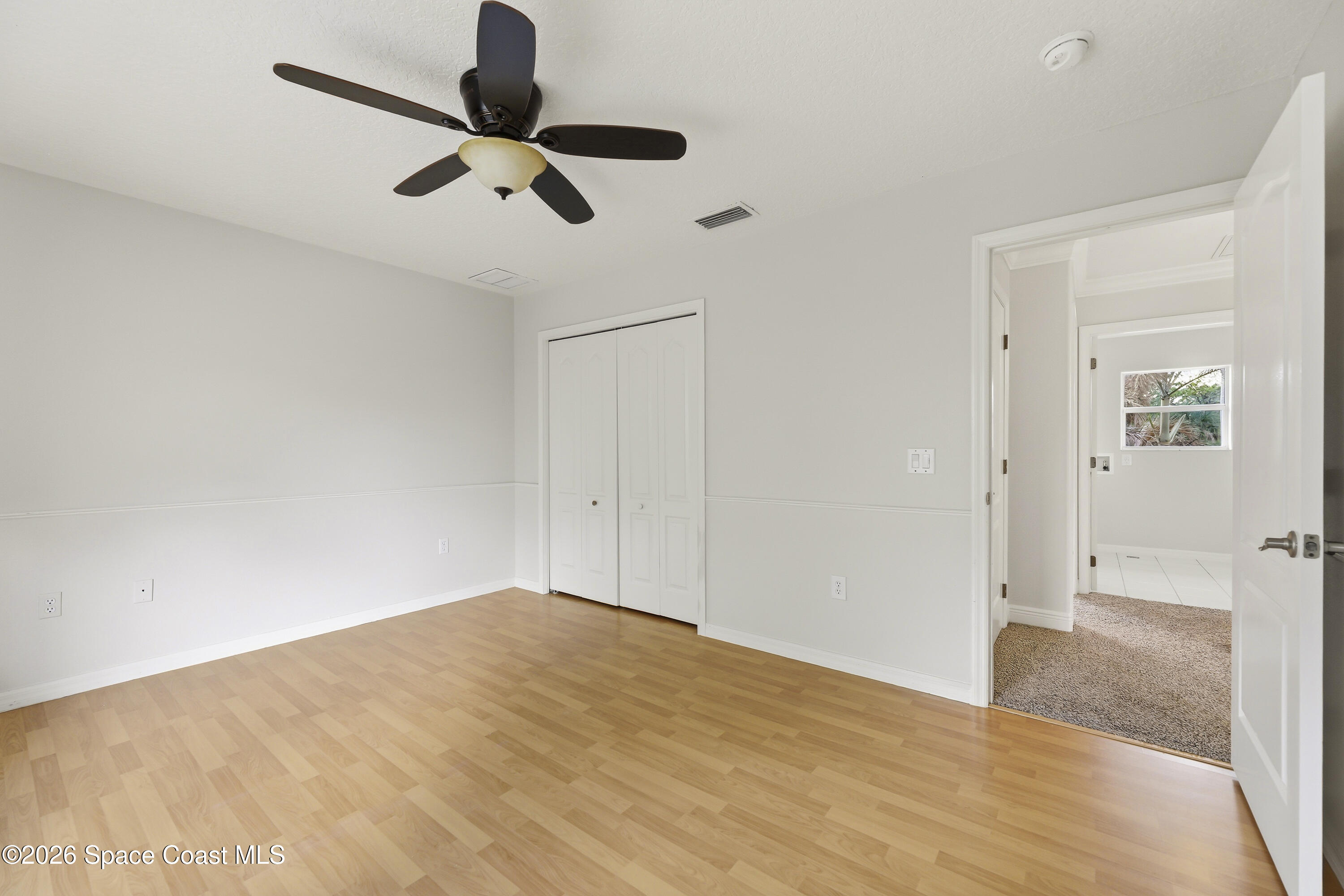 2300 Duncil Lane Malabar, FL 32950 - Photo 45 of 86 a view of empty room with wooden floor