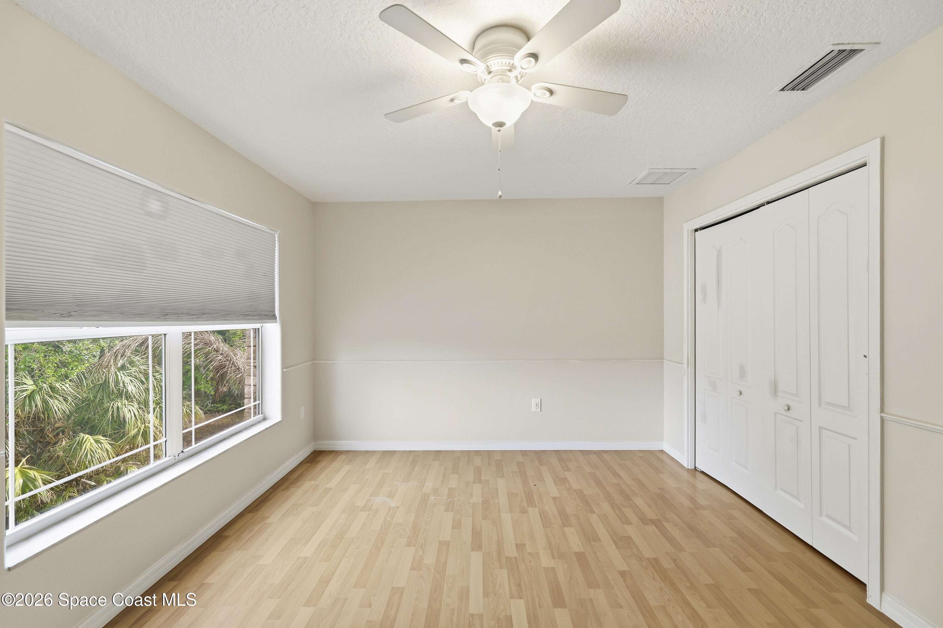 2300 Duncil Lane Malabar, FL 32950 - Photo 47 of 86 wooden floor in an empty room with a window
