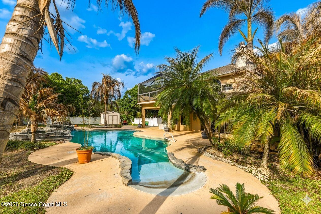 2300 Duncil Lane Malabar, FL 32950 - Photo 62 of 86 a view of a swimming pool with a patio
