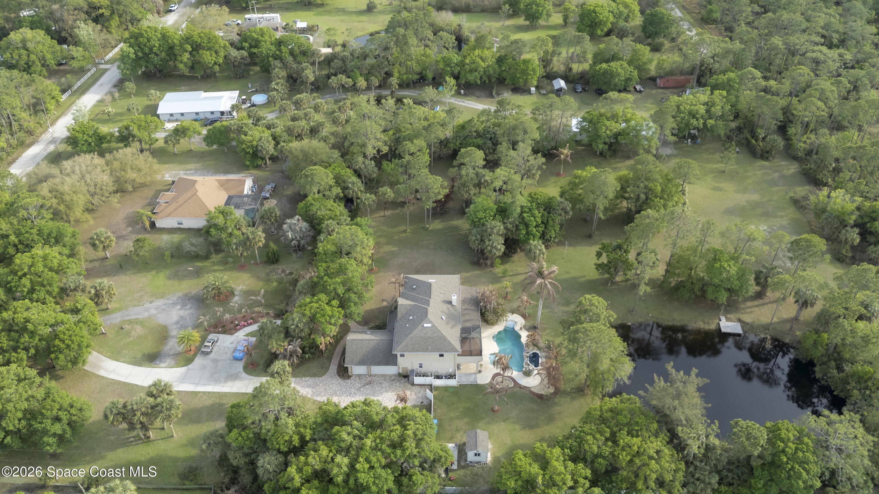 2300 Duncil Lane Malabar, FL 32950 - Photo 79 of 86 an aerial view of residential house with outdoor space and trees around