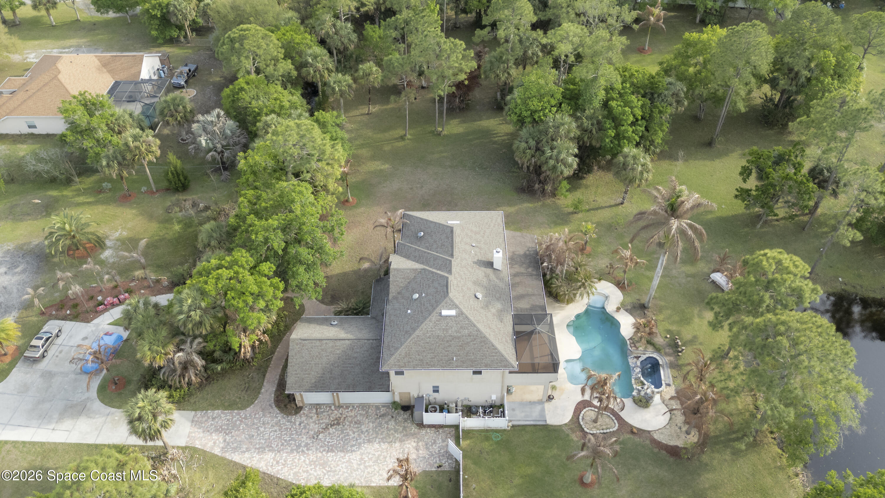 2300 Duncil Lane Malabar, FL 32950 - Photo 80 of 86 an aerial view of a house with a yard and lake view