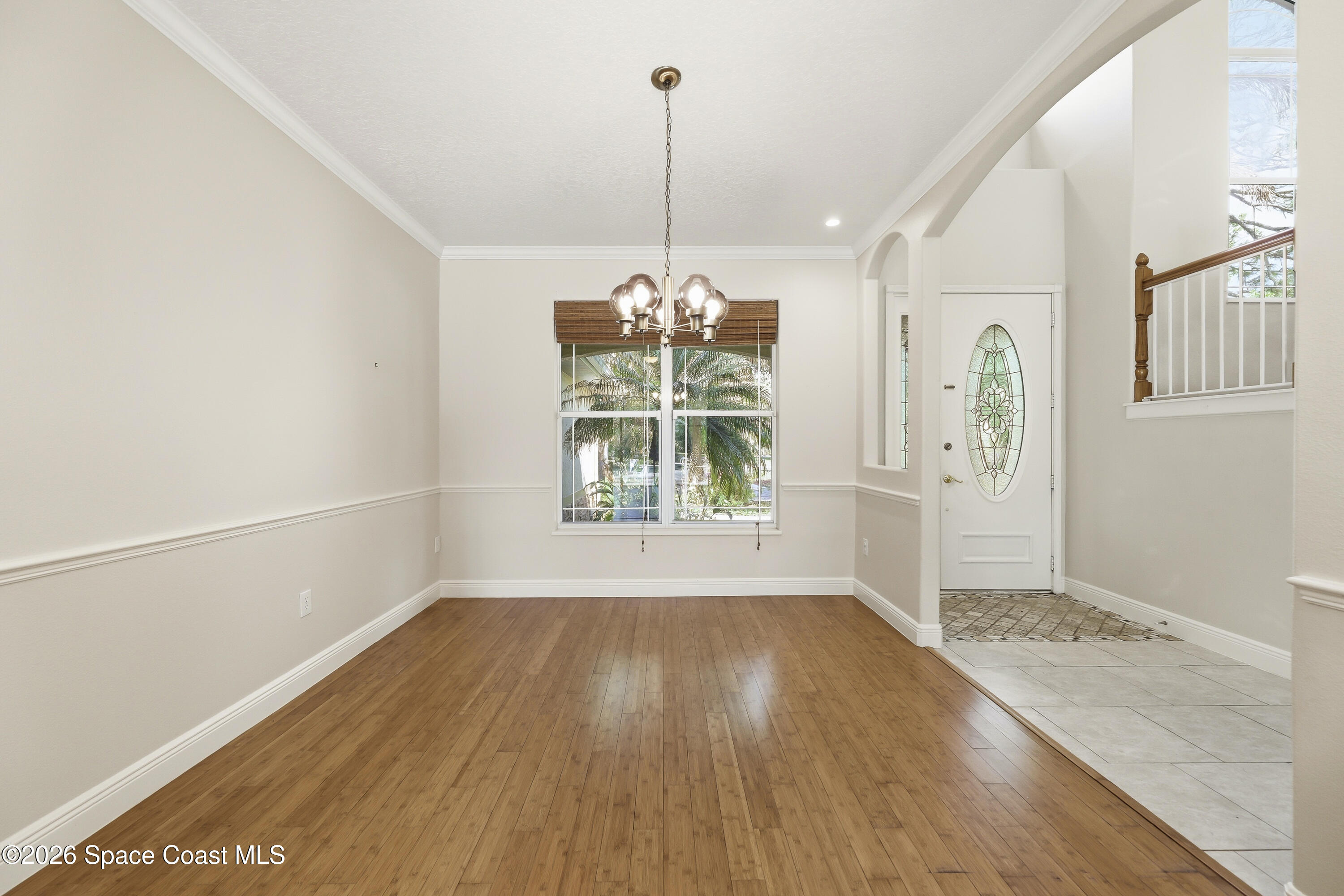 2300 Duncil Lane Malabar, FL 32950 - Photo 8 of 86 a view of a room with window wooden floor and a chandelier