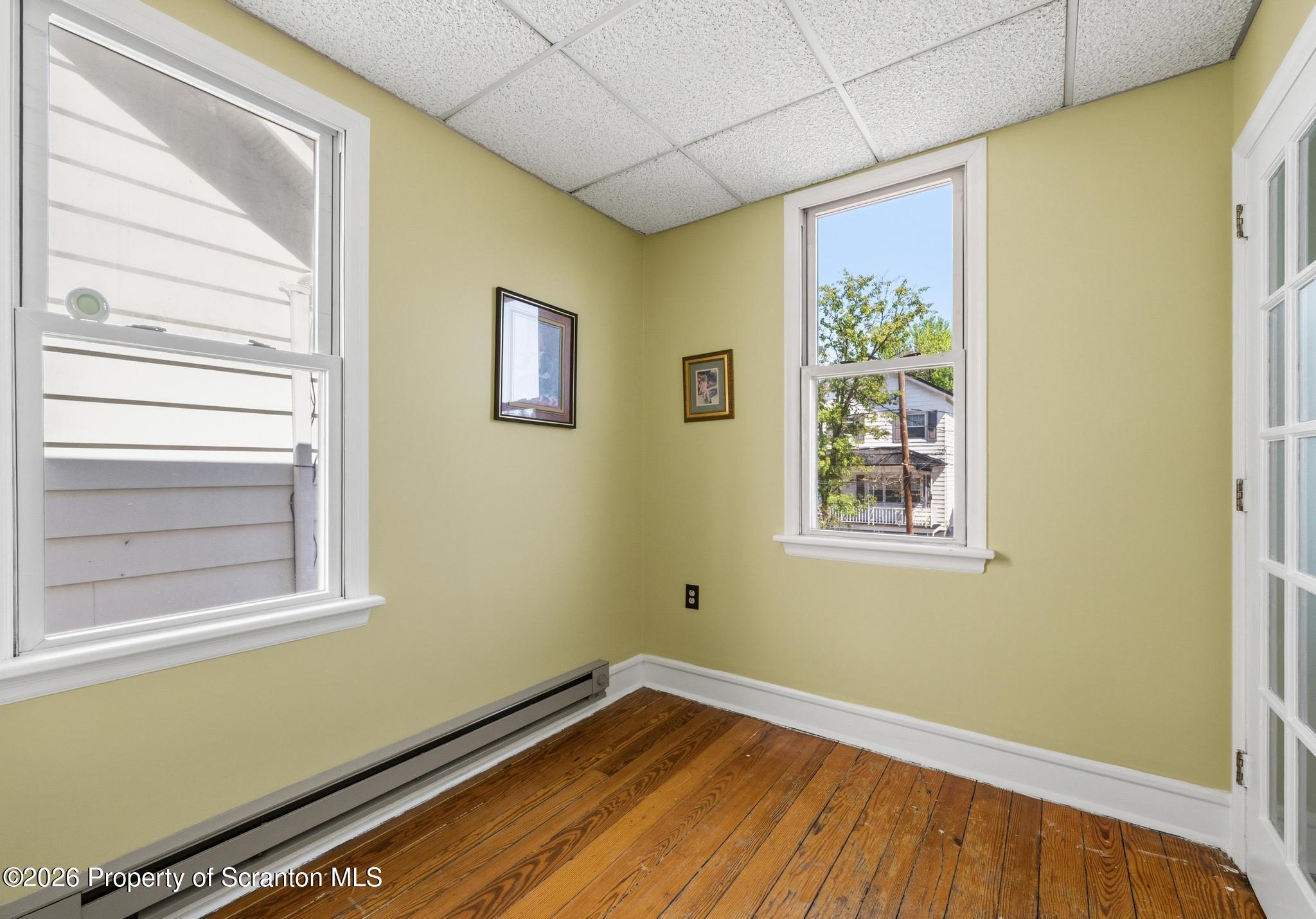 518 Prospect Avenue Scranton, PA 18505 - Photo 56 of 59 a view of a room with wooden floor and windows