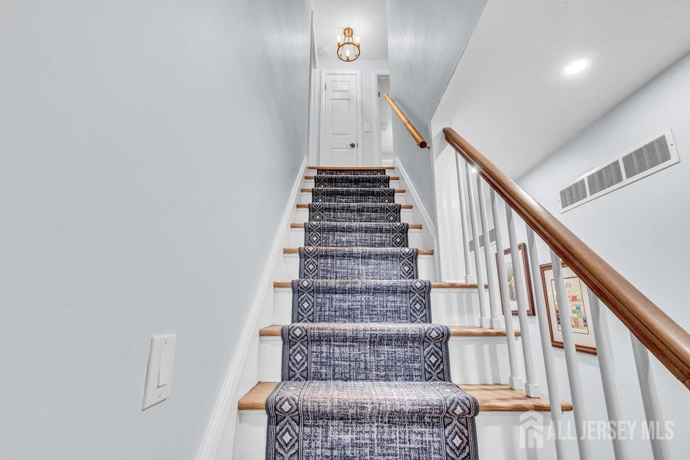 110 Springcrest Drive Hightstown, NJ 08520 - Photo 18 of 44 a view of entryway and hall with wooden floor