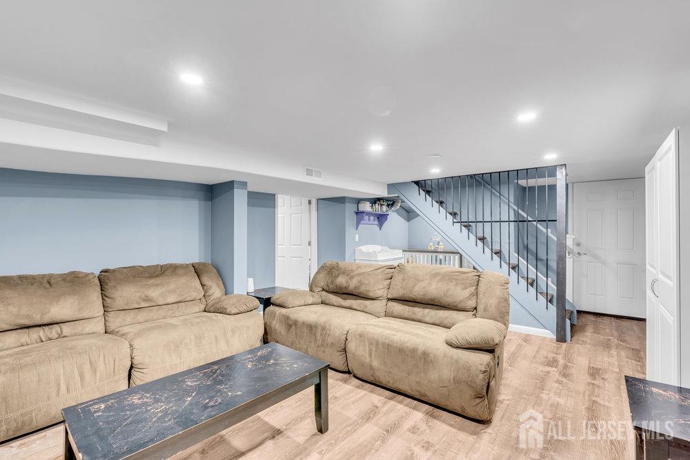 110 Springcrest Drive Hightstown, NJ 08520 - Photo 24 of 44 a living room with furniture and stairs