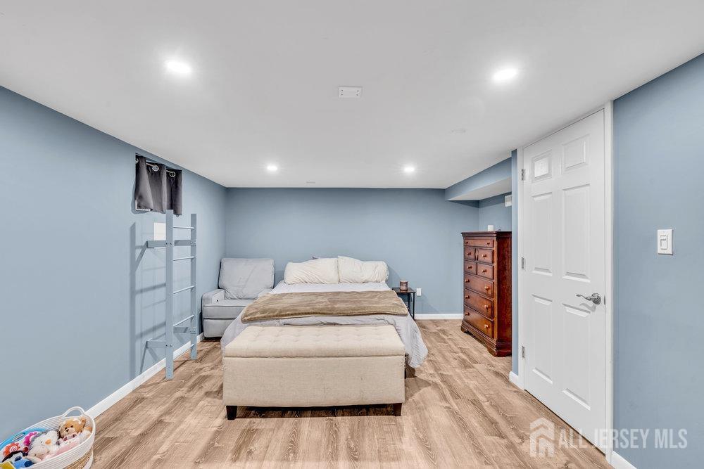 110 Springcrest Drive Hightstown, NJ 08520 - Photo 26 of 44 a room with a couch and a wooden floor