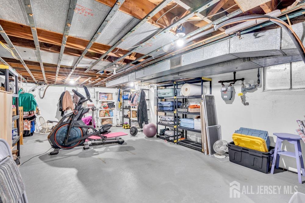 110 Springcrest Drive Hightstown, NJ 08520 - Photo 29 of 44 a view of a storage room with gym equipment
