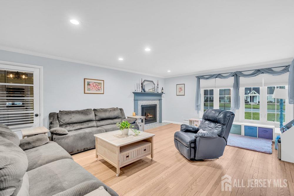 110 Springcrest Drive Hightstown, NJ 08520 - Photo 4 of 44 a living room with furniture and a fireplace