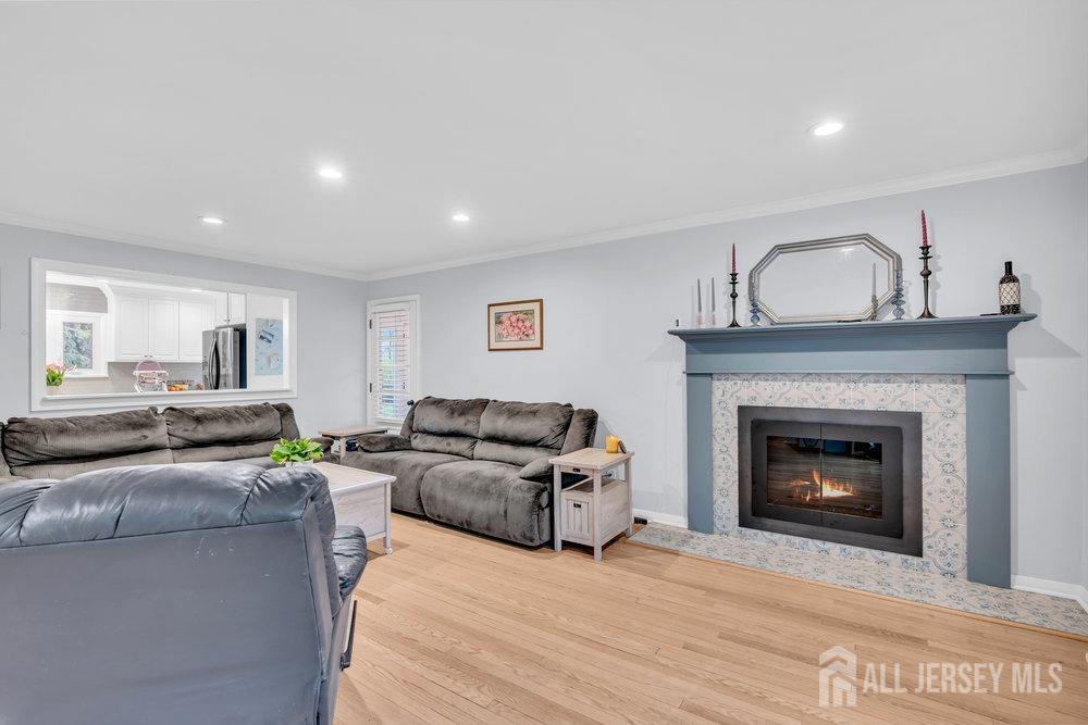 110 Springcrest Drive Hightstown, NJ 08520 - Photo 5 of 44 a living room with furniture and a fireplace